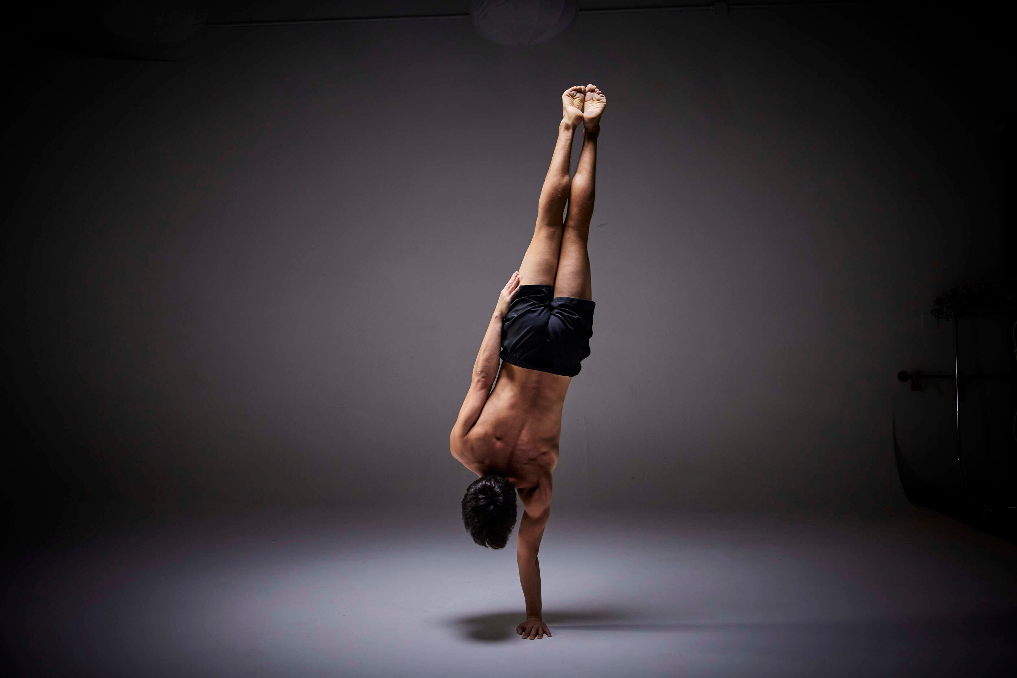 Josh in a one arm handstand shape